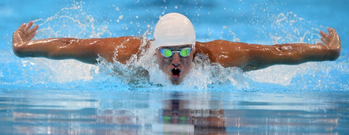 Ryan Lochte swims in the men's 400-meter individual medley preliminaries at the U.S. Olympic swimming trials, Monday, June 25, 2012, in Omaha, Neb. (AP Photo/Mark J. Terrill)